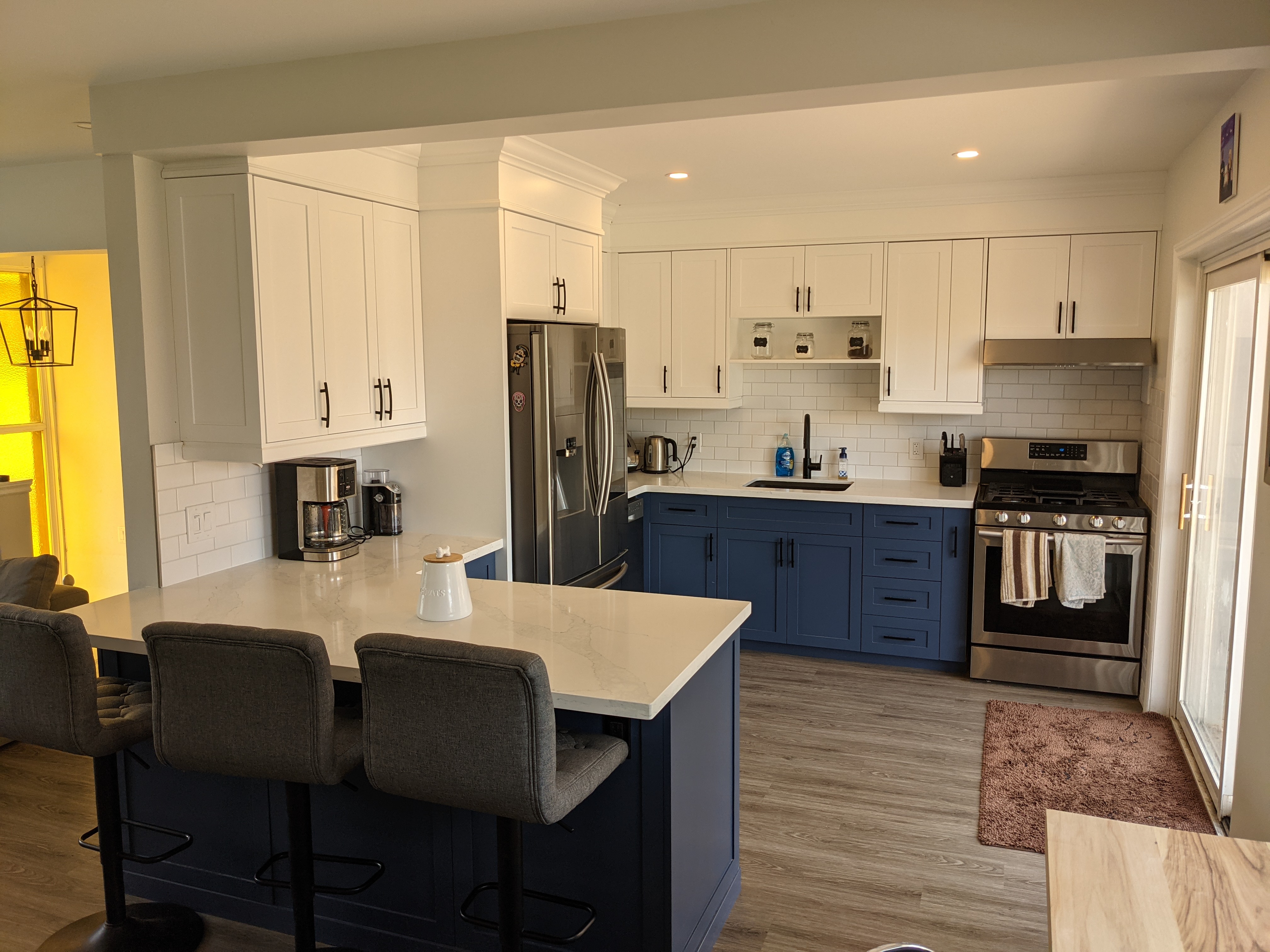 Beautifully painted and refaced white kitchen cabinets